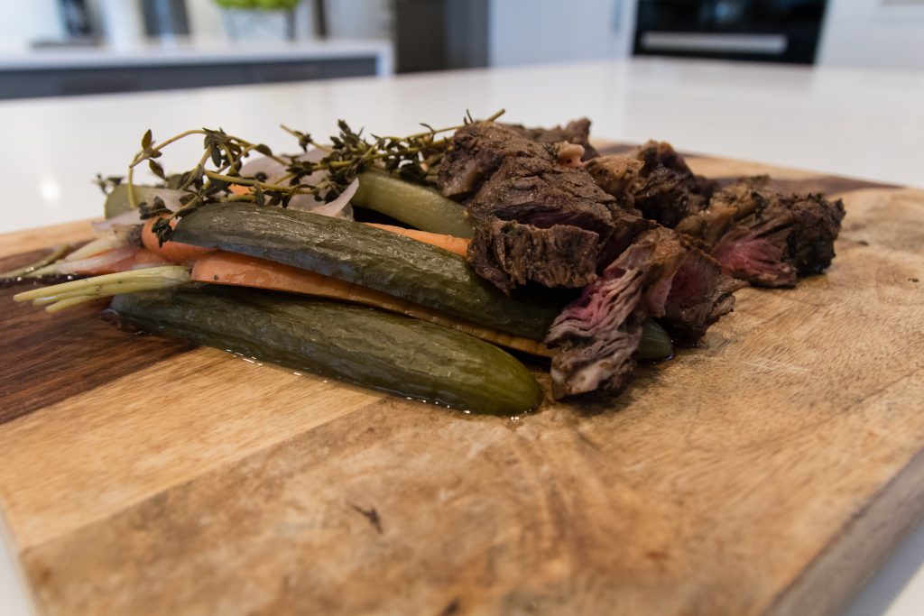 Charcoal Bison Skirt Steak with Dill Pickles and Sweet Red Mustard